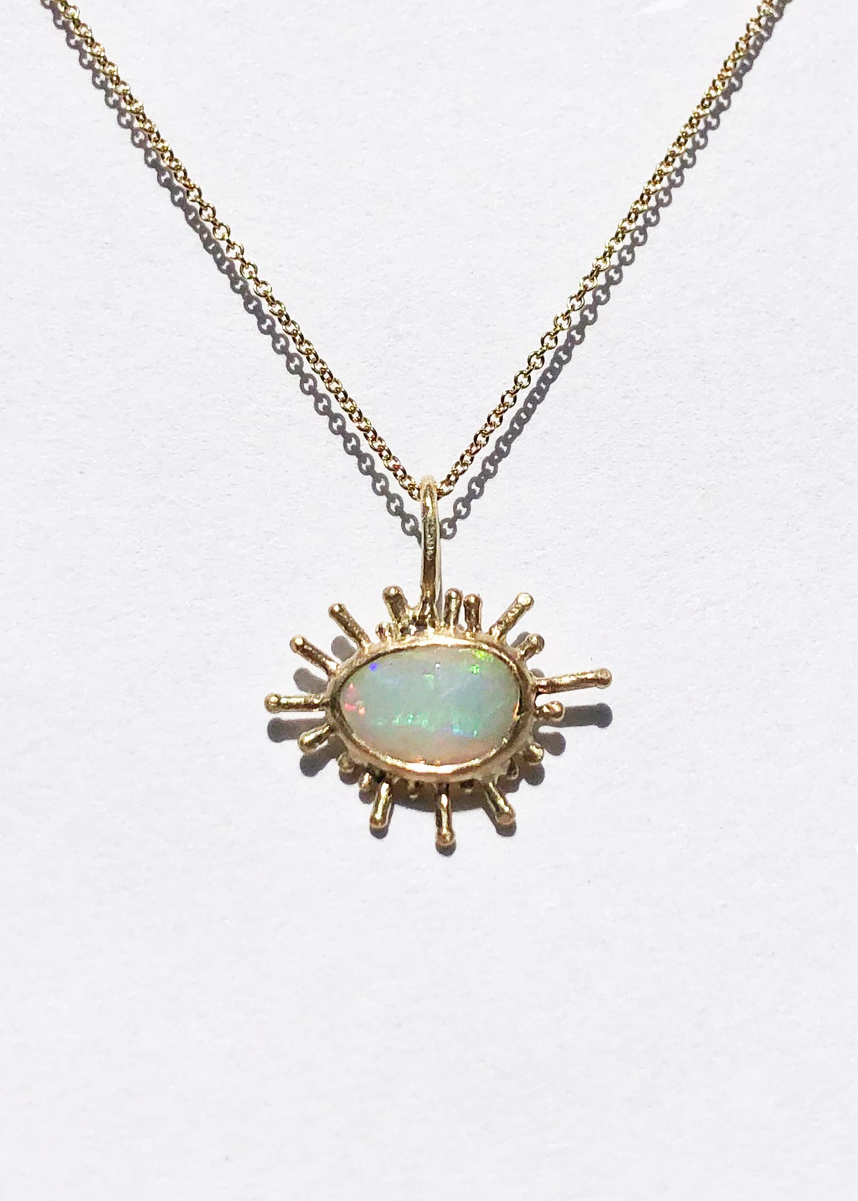 Fairmined gold pendant with opal / SUNBURST